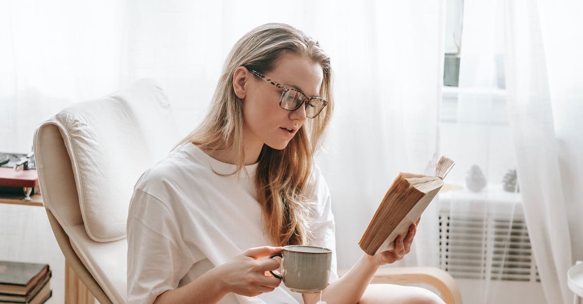 A woman holding a cup of coffee