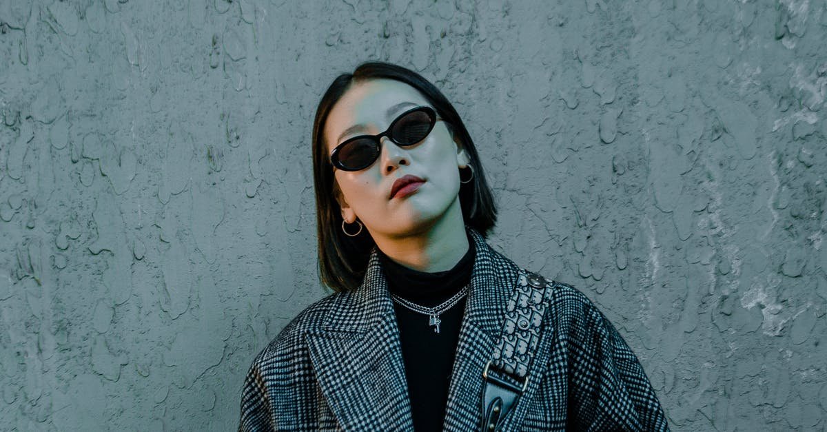 A woman wearing sunglasses posing for the camera