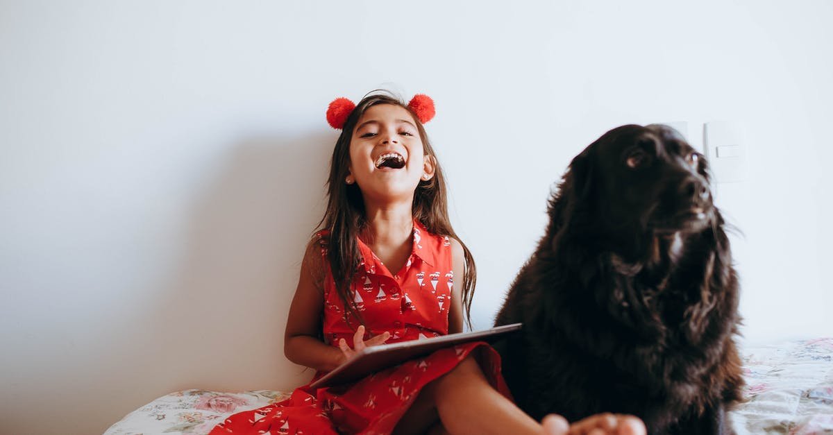 A woman holding a dog