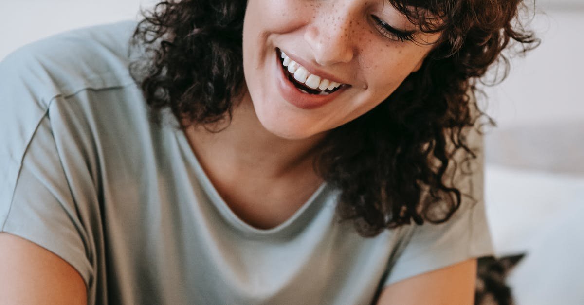 A person who is smiling and looking at the camera