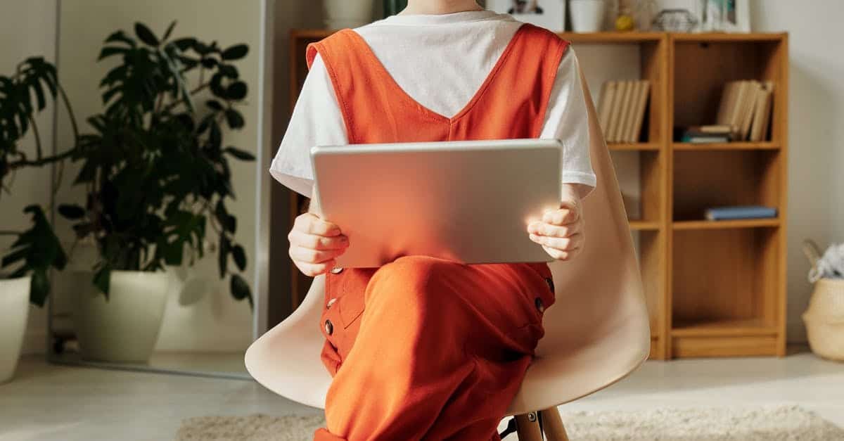A person sitting on a bed