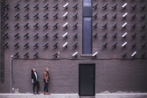 A group of people standing in front of a brick building