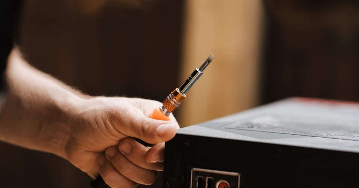 A hand holding a cell phone