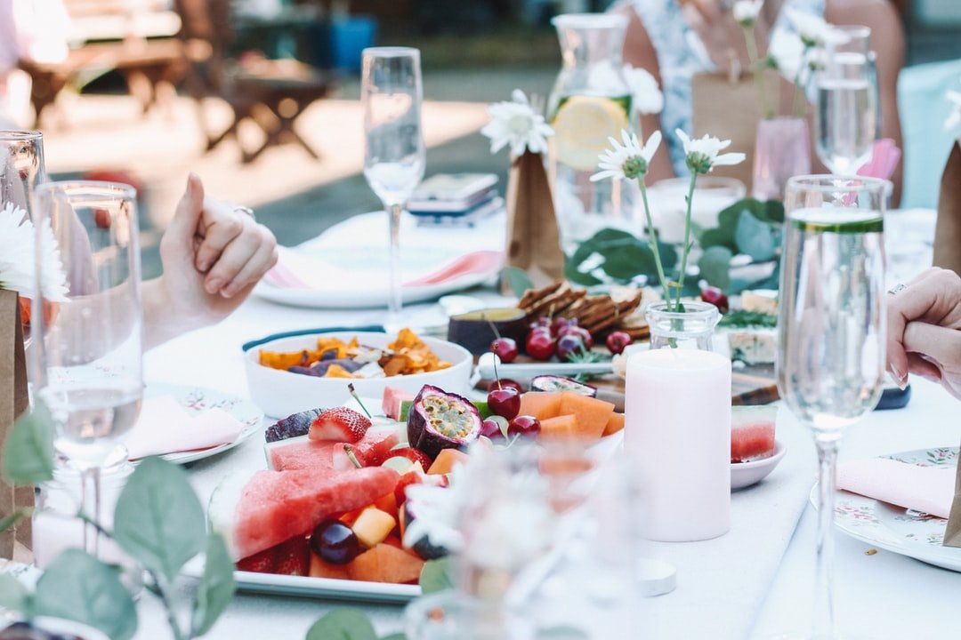 A group of people sitting at a dinner table